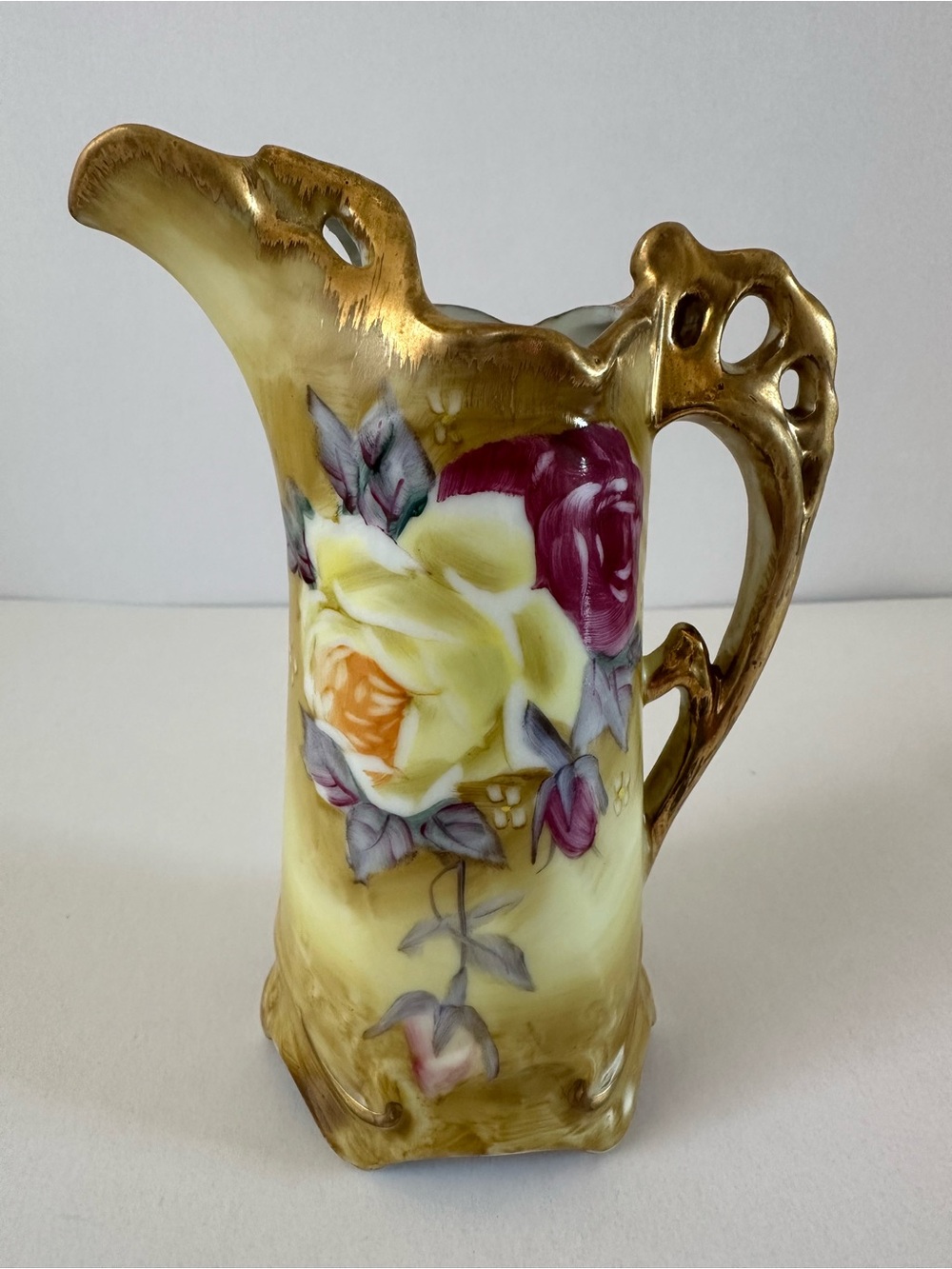 Nippon  hand painted antique petite creamer, bud vase with gold trim.